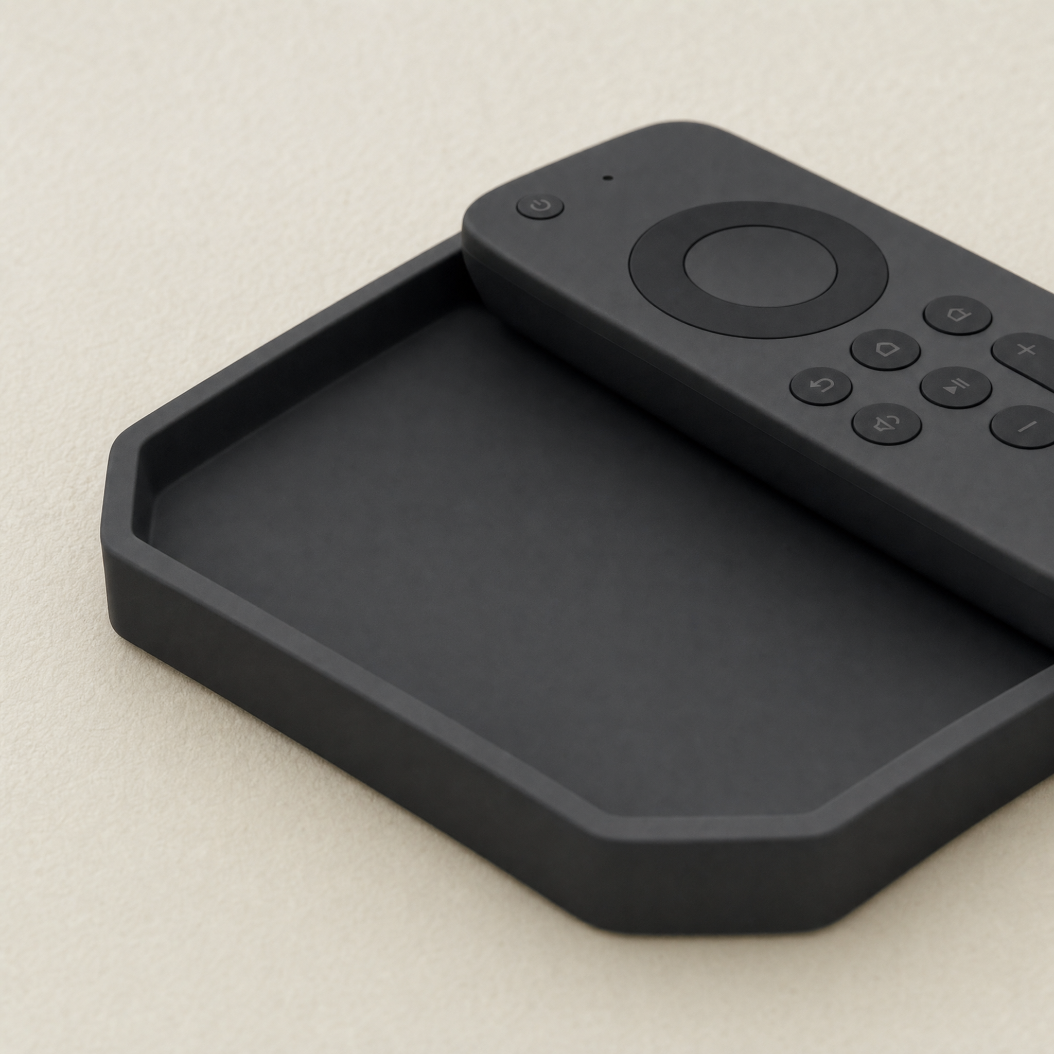A silicone snack tray on a couch armrest holding a bowl of popcorn and a remote